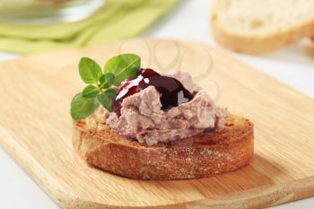 Toasted bread and pate with cranberry sauce 