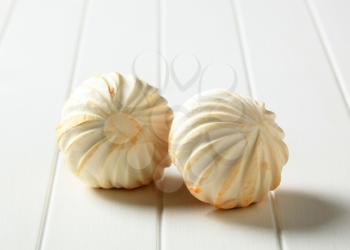 Closeup of two carved white button mushrooms