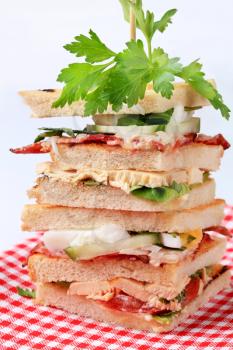 Stack of tasty club sandwiches - closeup