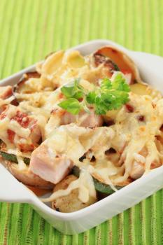 Pork and potato casserole topped with cheese