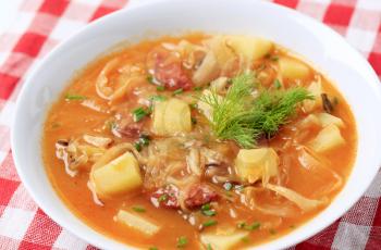 Cabbage soup with potatoes and sausage
