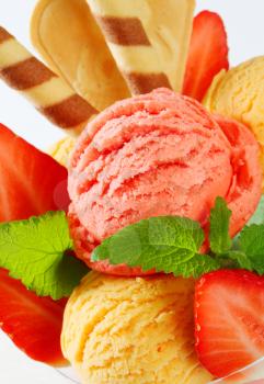 Fruit sherbets decorated with wafers and fresh strawberries
