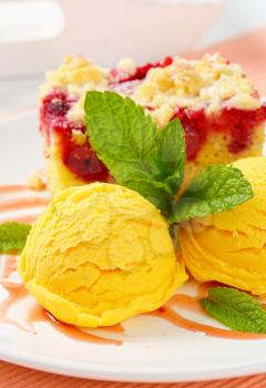 Piece of raspberry crumb cake with ice cream