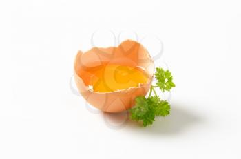 Egg yolk in half an eggshell