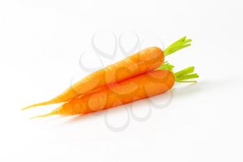Raw carrots on white background