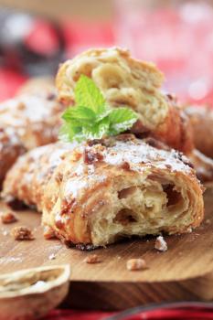 Puff pastry rolls with chopped nuts on top