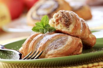 Sweet puff pastry rolls with nut filling