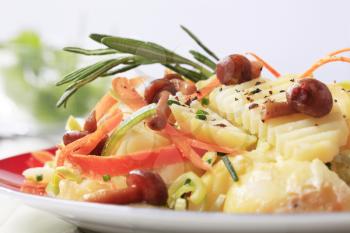 Potato salad with carrot and mushrooms - detail