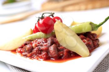 Vegetarian chili with potatoes and pepper - closeup
