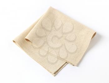 Small folded linen napkin - studio shot