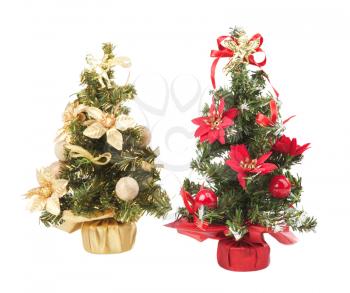 Two decorated artificial Christmas trees - isolated on white