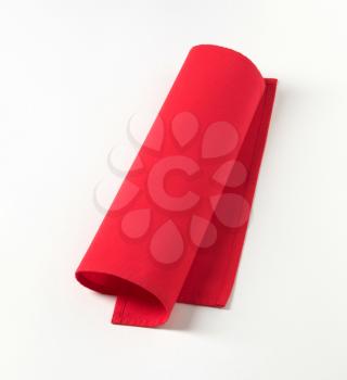 Small red napkin on white background