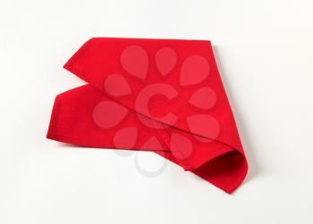 Small red napkin on white background