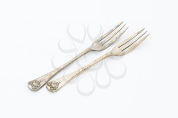 Vintage ornate forks with three tines