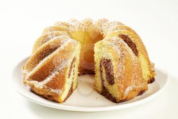 Marble cake sprinkled with icing sugar