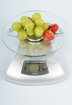Fruit on a kitchen scale
