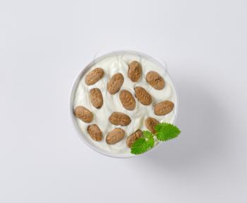 Bowl of yogurt with mini chocolate breakfast biscuits