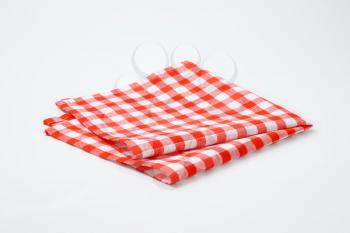 red and white checkered cloth napkin