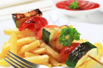 Dish of vegetable skewer and French fries