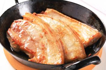 Pan fried pork belly slices