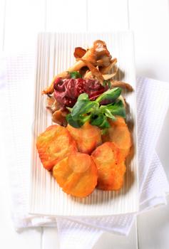 Chicken nuggets with sauteed oyster mushrooms