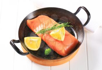 Fresh salmon fillet in a fry pan