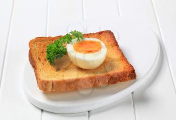 Slice of toasted bread and boiled egg