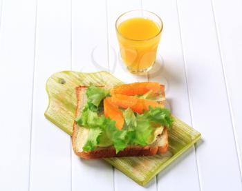 Healthy sandwich and glass of orange juice