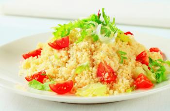 Couscous with salad greens and cherry tomatoes