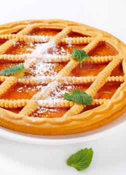 Round lattice topped apricot tart 