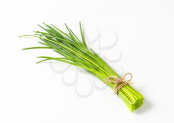 Bunch of fresh chives on white background