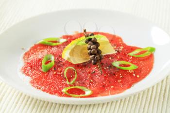 Beef Carpaccio with lemon, ground pepper and spring onion