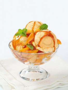 Ice cream with fresh apricot and caramel sauce
