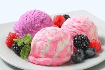 Scoops of ice cream with fresh berries