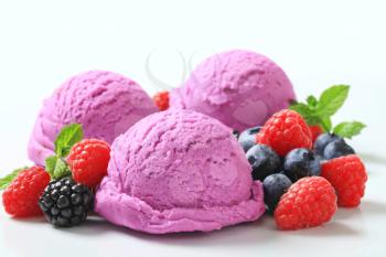 Scoops of ice cream with fresh berries