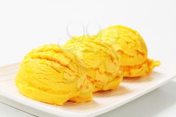 Scoops of mango vanilla ice cream