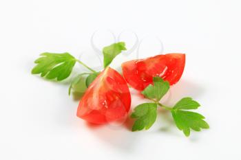 Red tomato wedges and parsley leaves