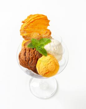 Scoops of ice cream garnished with Spritz cookie