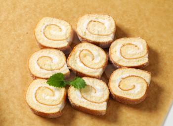 Slices of sponge cake roll with cream filling