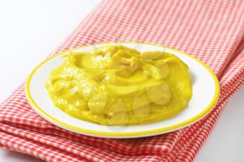 American yellow mustard on plate