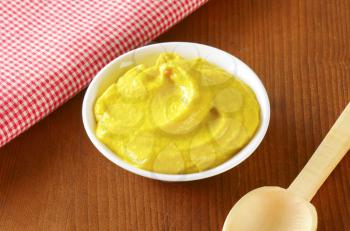 Bowl of American yellow mustard