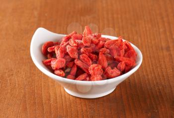 Dried goji berries in small bowl