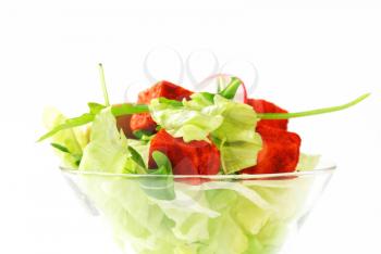 Vegetable salad with olives and paprika-coated cheese 