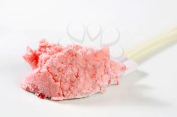 Strawberry ice cream on kitchen spatula