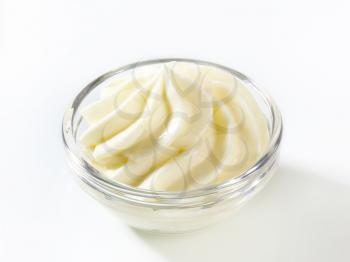 Swirl of cream cheese in glass bowl