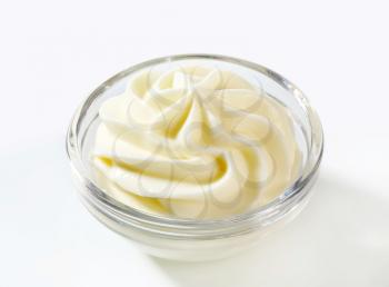Swirl of cream cheese in glass bowl