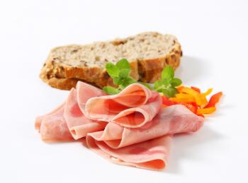 Thin slices of ham and wholegrain bread