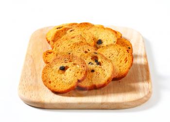 Small round toasts with black olives