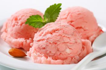 Three scoops of strawberry sorbet