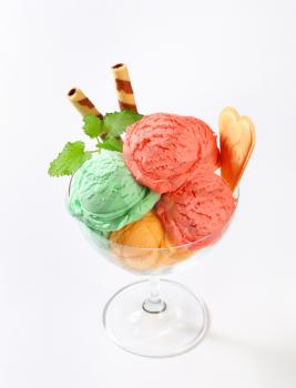 Scoops of fruit sherbets decorated with wafers
